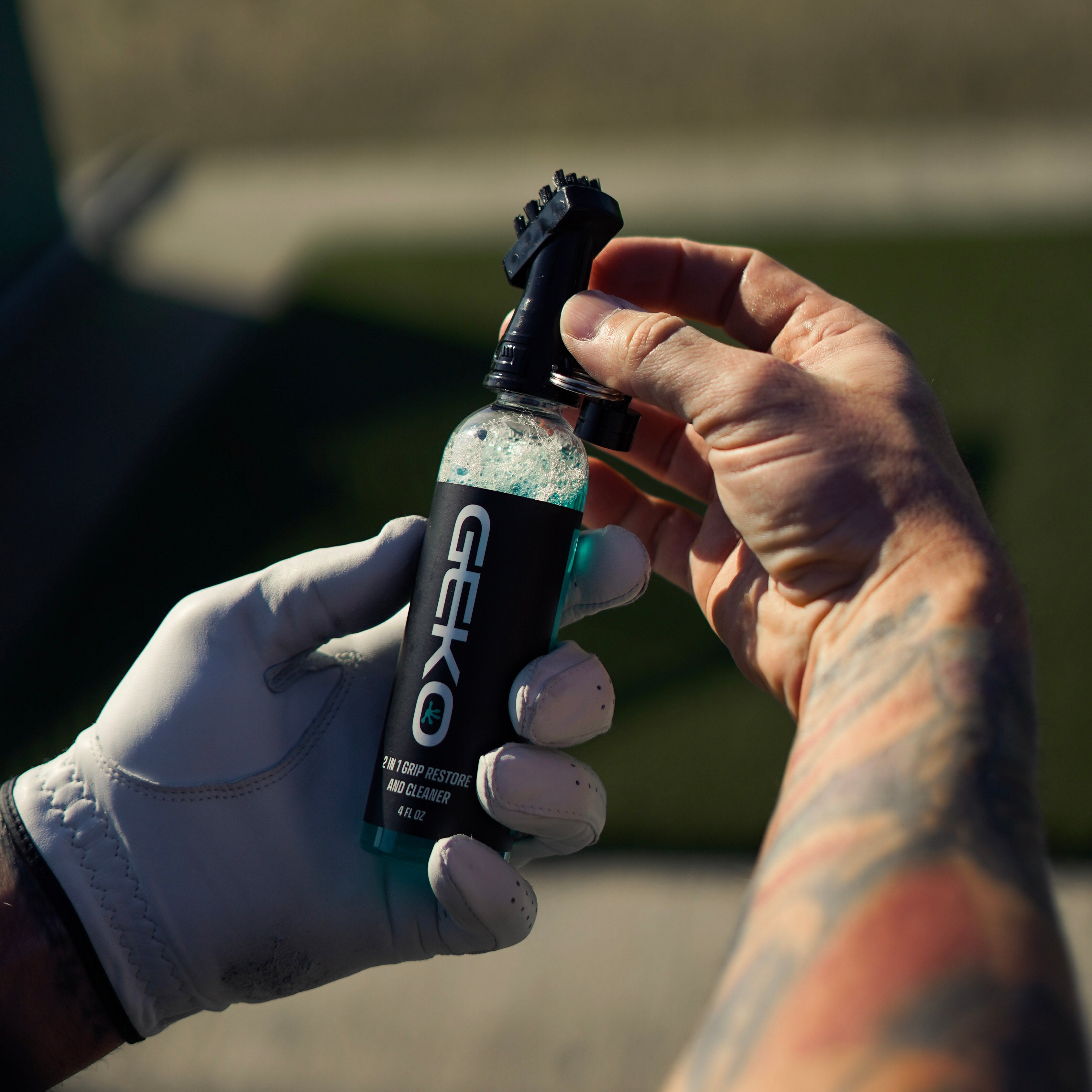 Golfer holding a bottle of Geko