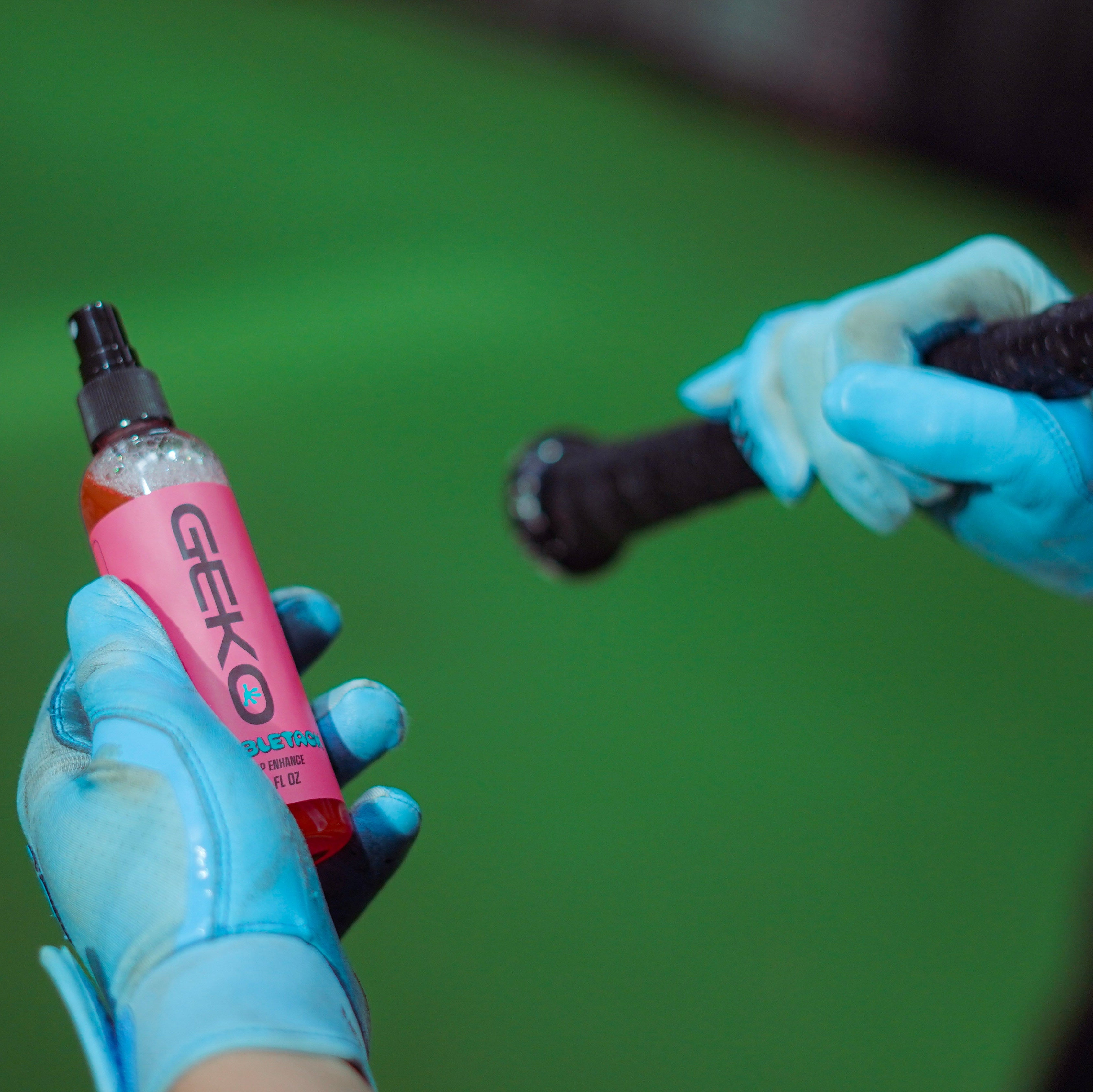 baseball player holding bubbletack and baseball bat