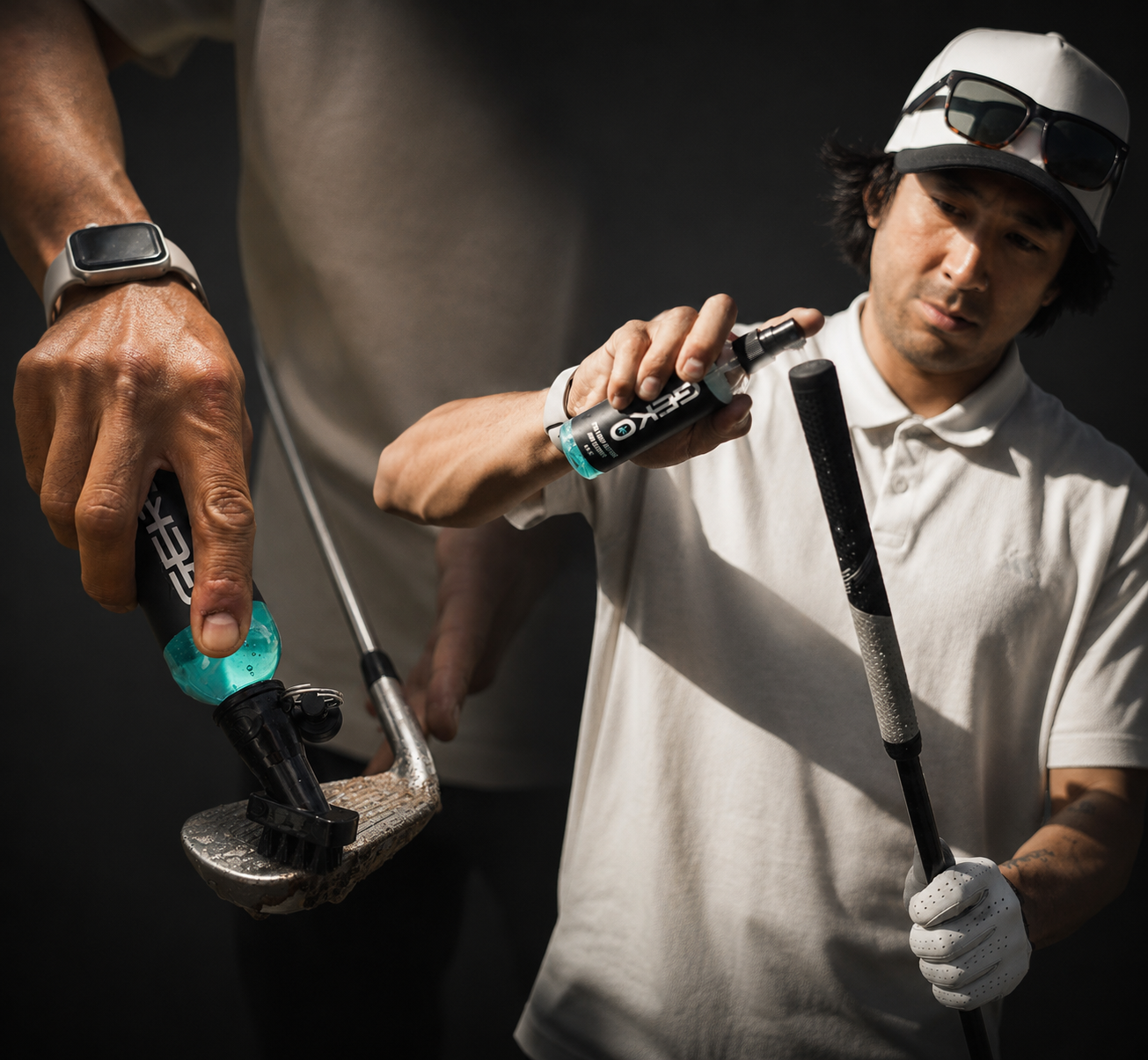 A lifestyle shot of a man in a white polo shirt and cap using a teal and black golf club head repair tool on his club, with a close-up of the tool on the left.